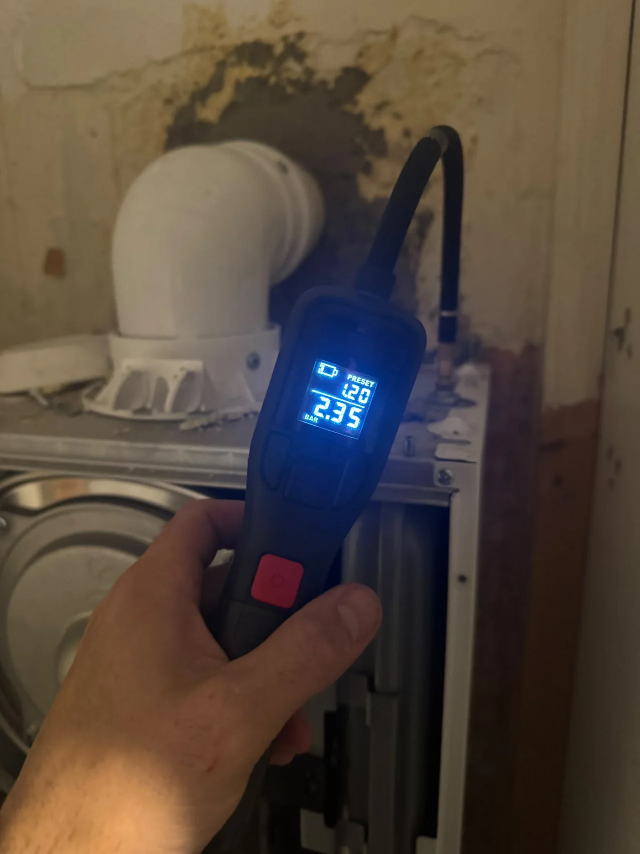 DPB checking boiler pressure with a digital meter