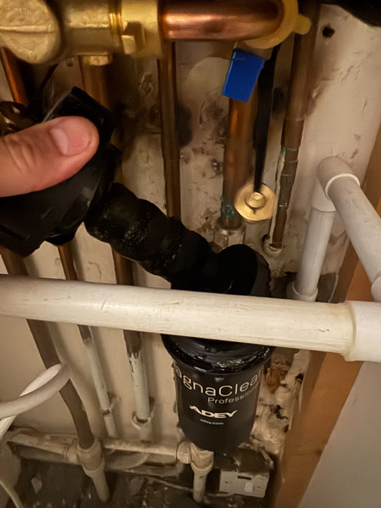 DPB opening a boiler system magnetic filter for maintenance